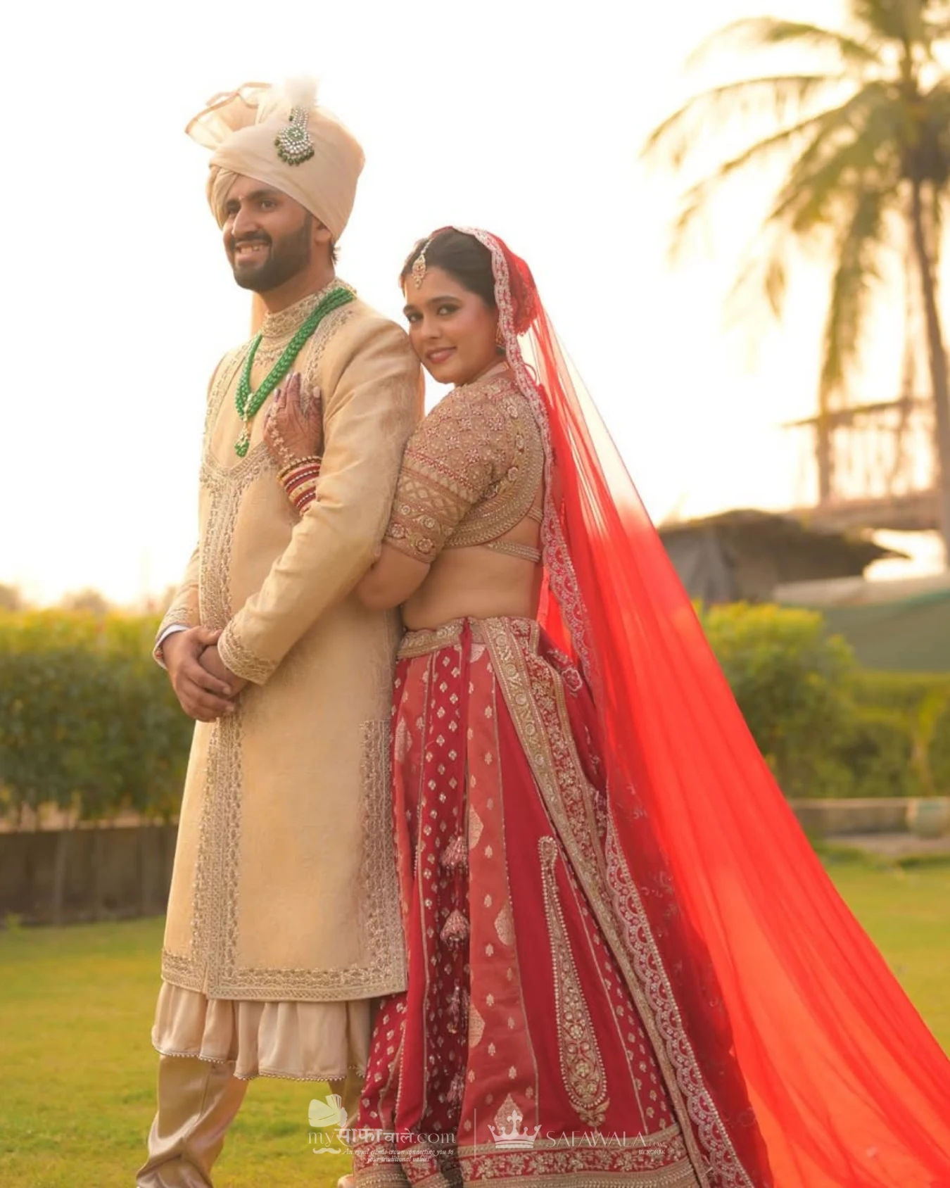 Classic groom pagdi styled with a red ceremonial stole for Akshi
